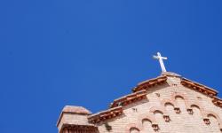 A cross and the blue skies of Italy