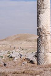 A column and barren hills