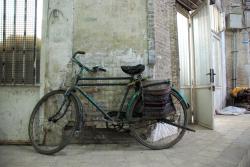 A bicycle waits for its owner