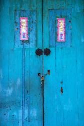 An intensely aqua coloured door