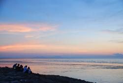 Teenagers watching the sunset in Pontian