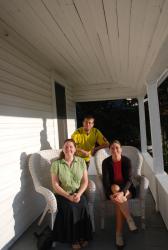 Melissa, Friedel and Andrew on the porch of Melissa's new home