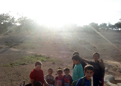 Local kids surround us near our camping spot